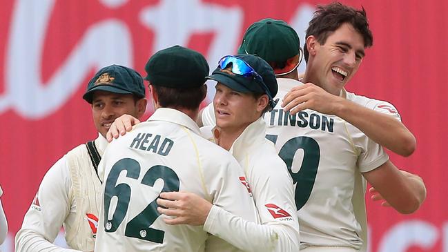 The Australian team celebrate after England were bowled out on the fifth day of the first Ashes cricket Test match between England and Australia at Edgbaston.