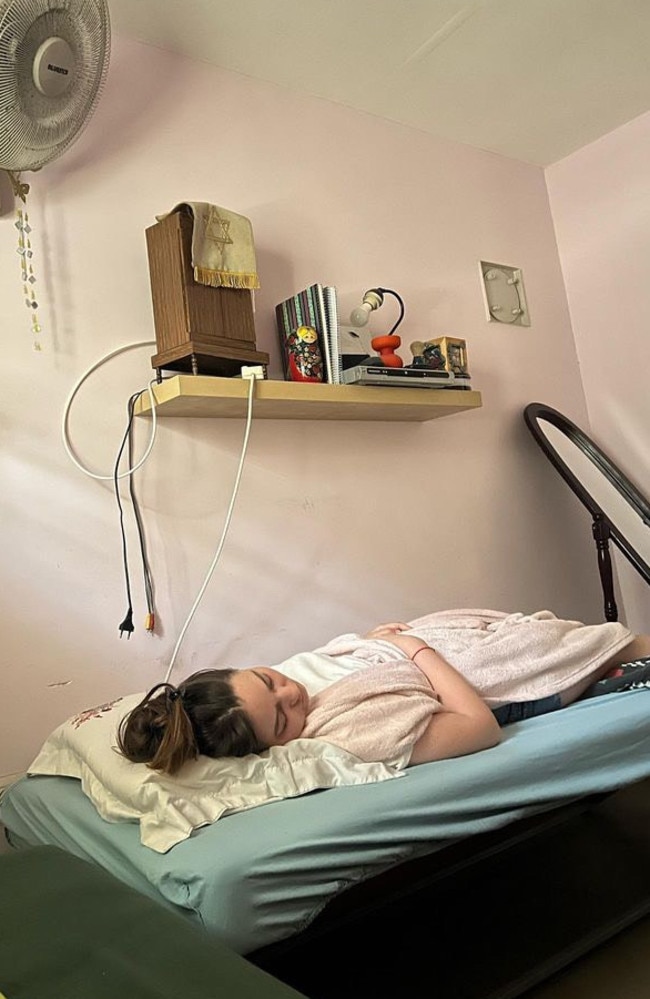 Palmerston photographer Asher Lilley with a friend (pictured) in a bomb shelter after a recent escalation of violence in Israel.