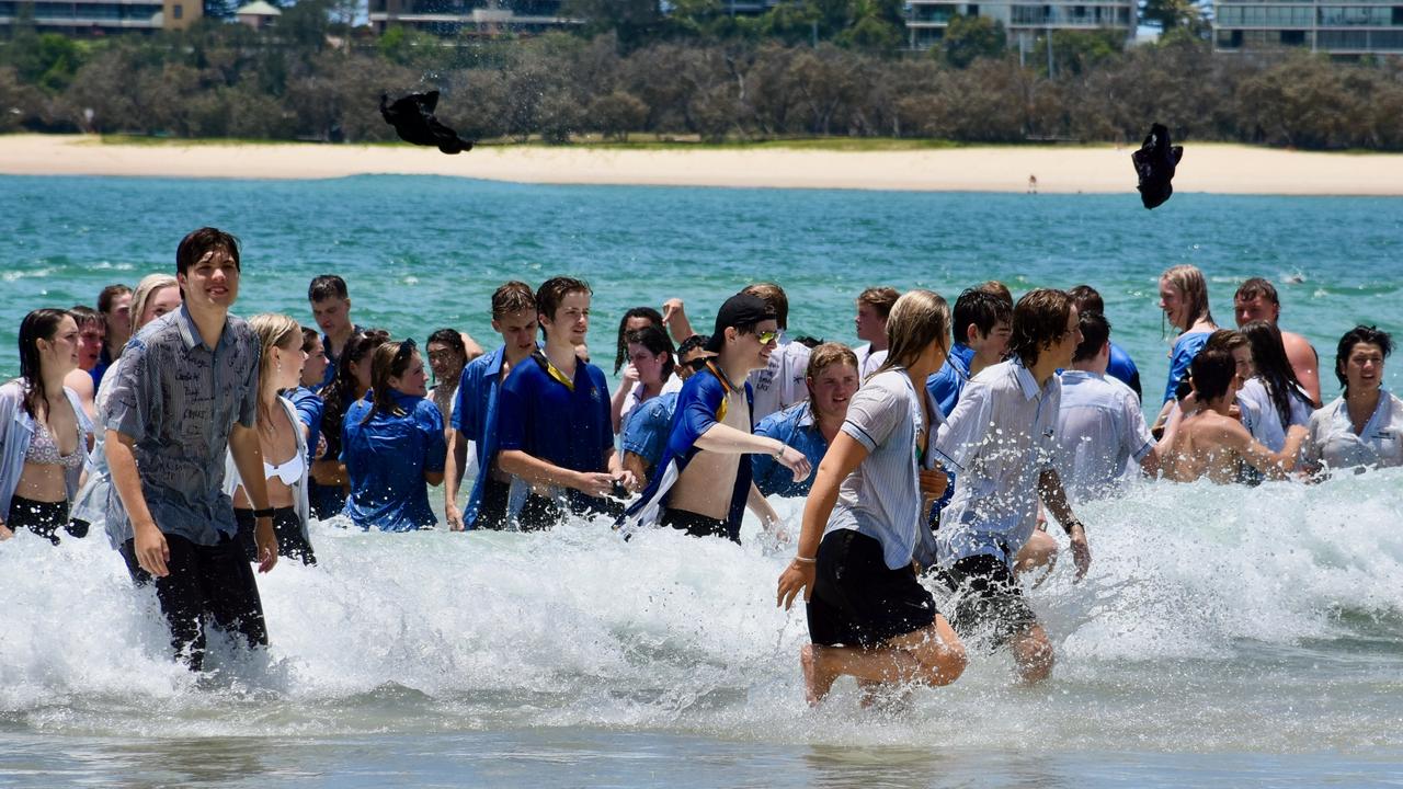 Year 12 graduates from schools across the Sunshine Coast hit to the water at Mooloolaba Beach to celebrate the end of their schooling. Photo: Mark Furler