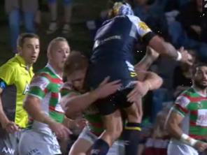 Images from channel nine that show that show Johnathan Thurston being ruffed up by South Sydney