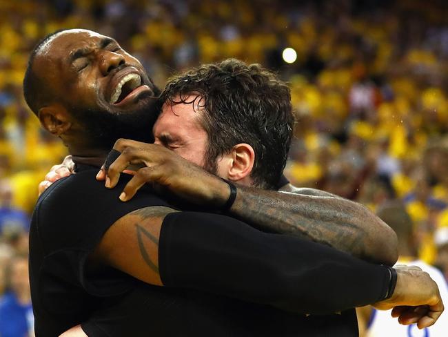 Iconic. LeBron bear-hugs Kevin Love after beating the Warriors.