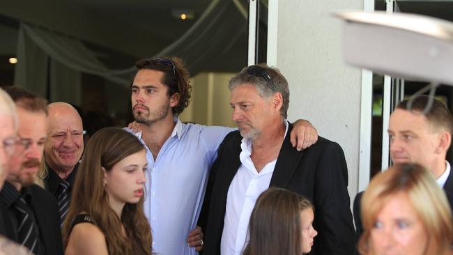 Sam’s brother Nick and father Tim at the funeral held at the Dream Centre Church at Carrara.