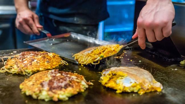Osaka is known for its local specialty, savoury okonomiyaki (pancakes).