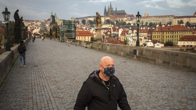 A man walks on the medieval Charles Bridge, Prague, in the Czech Republic. The Czech Republic is under partial lockdown until November 3. Photo: Gabriel Kuchta Getty Images.