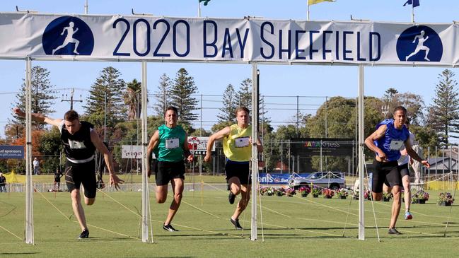 James Bayliss stumbles over the line to win. Picture: Russell Millard