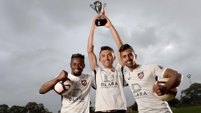 Ghan Kilburn City teammates (L-R) Ibby Kamara, Javeed Zamini (captain) and Masoud Teymouri after winning the 2020 Sunday Division one amateur soccer title. Picture: Naomi Jellicoe