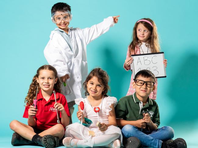 Kindergarten students Chloe, Luca, Annabelle, Jonathan, and Aaliyah are excited about going to school and becoming their dream professions - mechanic, scientist, dancer/doctor, engineer, and teacher.Photo: Tom Parrish