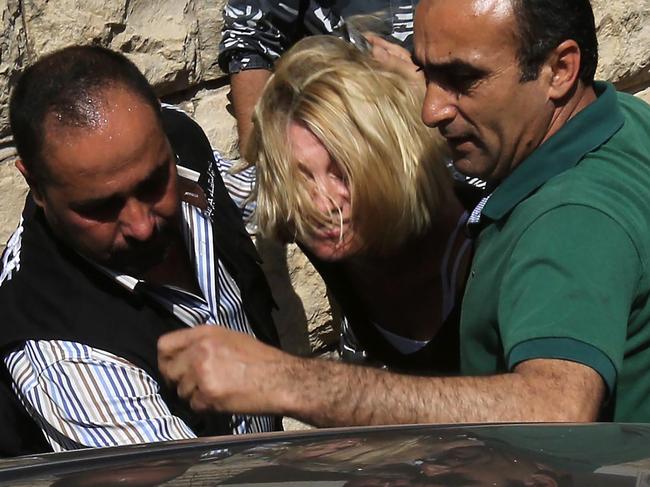 Tara Brown being escorted from a Lebanese courthouse to Baabda Prison for women during the 60 Minutes scandal. Picture: AFP