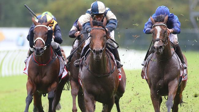 Our Ivanhowe, ridden by Kerrin McEvoy (centre), takes the lead to win the Ranvet Stakes. Picture: AAP