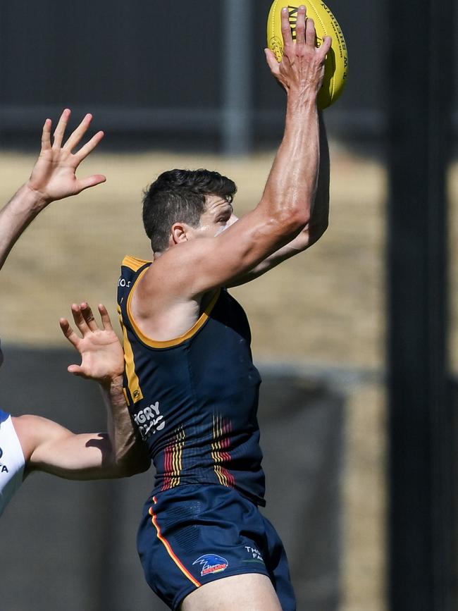 Chris Burgess of the Crows marks during an Adelaide Crows AFL training session at West Lakes. Picture: Mark Brake/Getty Images.