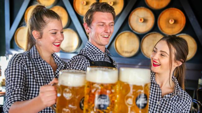 The Bavarian Rouse Hill employees Rebekah Olden, Andrew Mihailovic and Jess Hewes-Weeks cheers to the start of the soon-to-be-opened restaurant. Pictures: Angelo Velardo