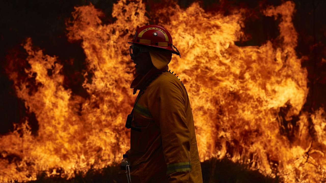 A Country Fire Authority member works on controlled back burns. Picture: Brett Hemmings/Getty Images