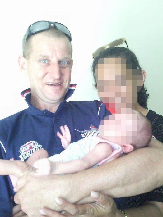 Raymond Holschier with one of the two children, born in 2001 and 2002, he claimed to have fathered with his then de facto in Junee prison. Picture: Facebook 