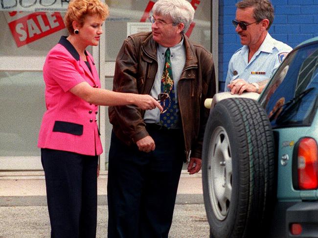 Ms Hanson attempts to help Mr Burston over a parking ticket at Cessnock in this undated picture. 