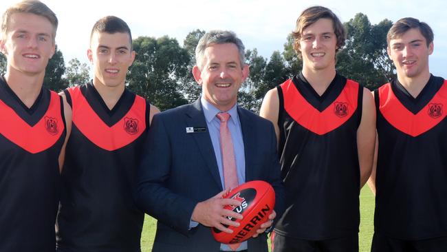 Rostrevor College principal Brian Schumacher with footballers (left to right) Jacob Kennerley, Luke Valente, Ben Jarvis and Cameron Taheny. Picture: Supplied.