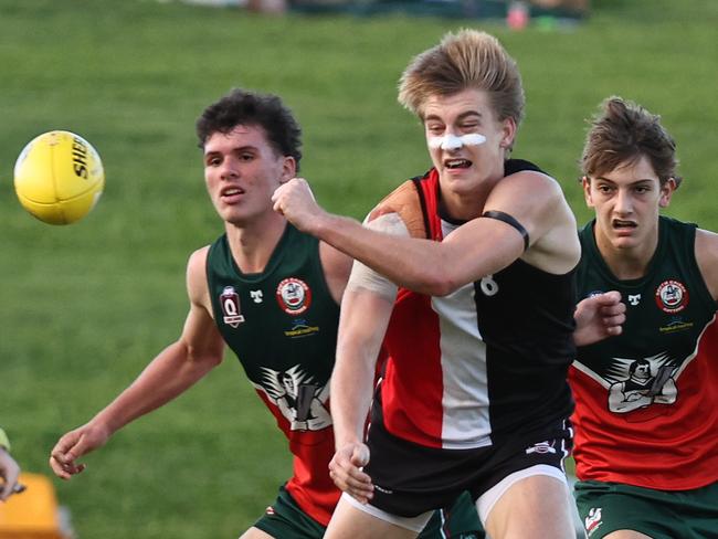 Saints vice captain Daniel Statton handballs in the AFL Cairns Under 17B grand final match between the Cairns Saints and the South Cairns Cutters, held at Cazalys Stadium, Westcourt. Picture: Brendan Radke