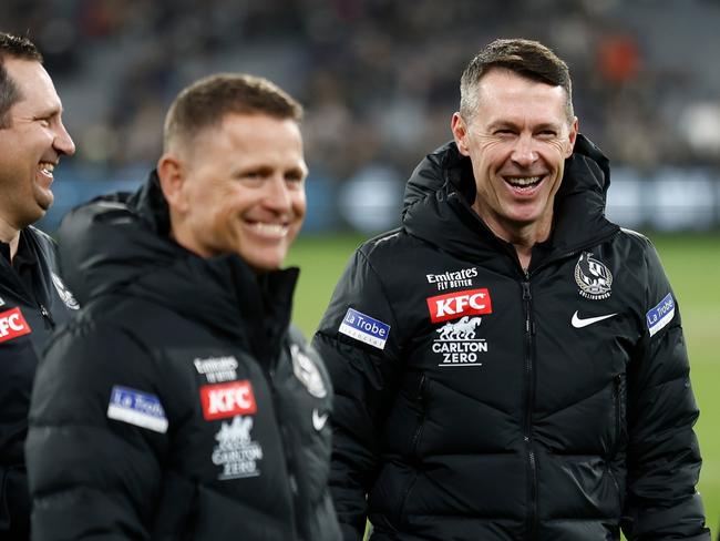 MELBOURNE, AUSTRALIA - MAY 21: (L-R) Hayden Skipworth, Brendon Bolton, Craig McRae and Justin Leppitsch of the Magpies celebrate during the 2023 AFL Round 10 match between the Carlton Blues and the Collingwood Magpies at the Melbourne Cricket Ground on May 21, 2023 in Melbourne, Australia. (Photo by Michael Willson/AFL Photos via Getty Images)