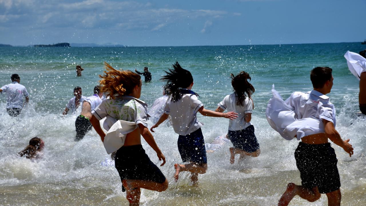 Year 12 graduates from schools across the Sunshine Coast hit to the water at Mooloolaba Beach to celebrate the end of their schooling. Photo: Mark Furler