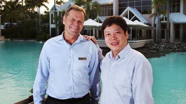 Sheraton Grand Mirage Port Douglas general manager Steve Molnar with Fullshare Group managing director Yi Yu at the resort's lagoon. Picture: Brendan Radke.