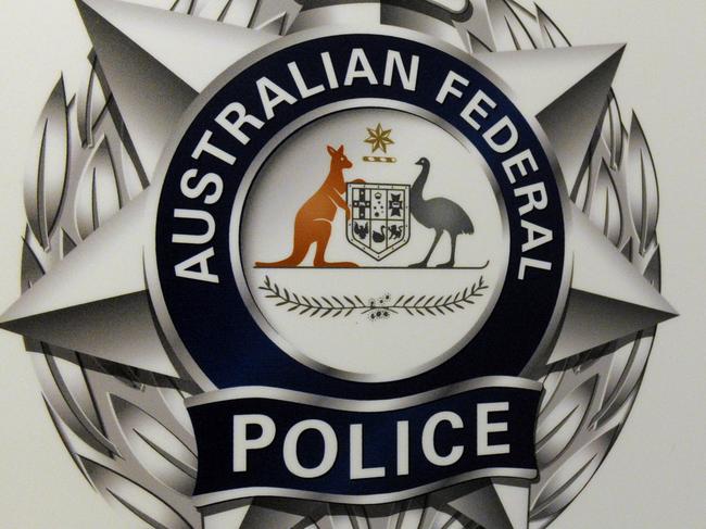 An Australian Federal Police logo is seen in Geelong, Friday, Oct 3, 2014. (AAP Image/Julian Smith) NO ARCHIVING