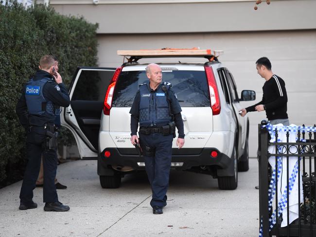 Police outside the home. Picture: Lawrence Pinder