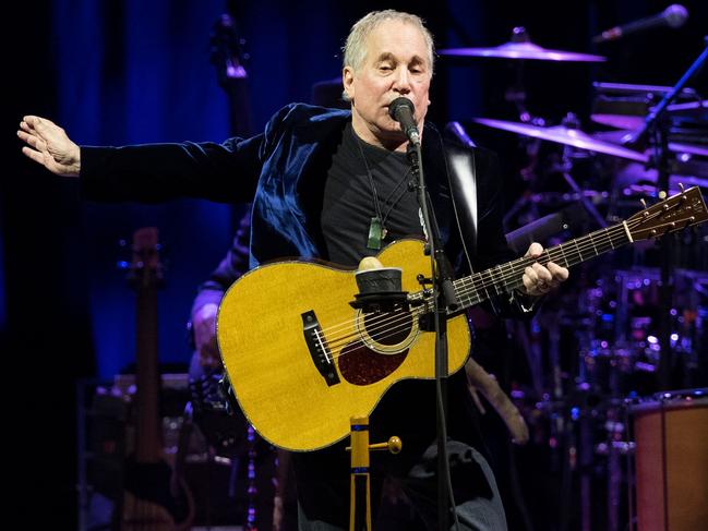 (FILES) In this file photo taken on November 17, 2016 US singer Paul Simon performs on stage at the Bilbao Exhibition Centre in the Spanish Basque city of Barakaldo on November 17, 2016. Folk rock legend Paul Simon on February 05, 2018, announced what he said would be his final tour, saying he had grown tired of traveling after 50 years as a performer. / AFP PHOTO / ANDER GILLENEA