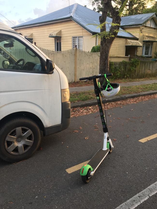 A Lime scooter left on the road in Brisbane