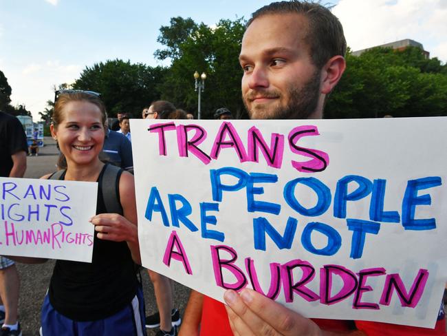 Protesters gather in front of the White House following Mr Trump’s announcement that transgender people may not serve “in any capacity” in the US military, citing the “tremendous medical costs and disruption” their presence would cause. Picture: Paul J Richards/AFP