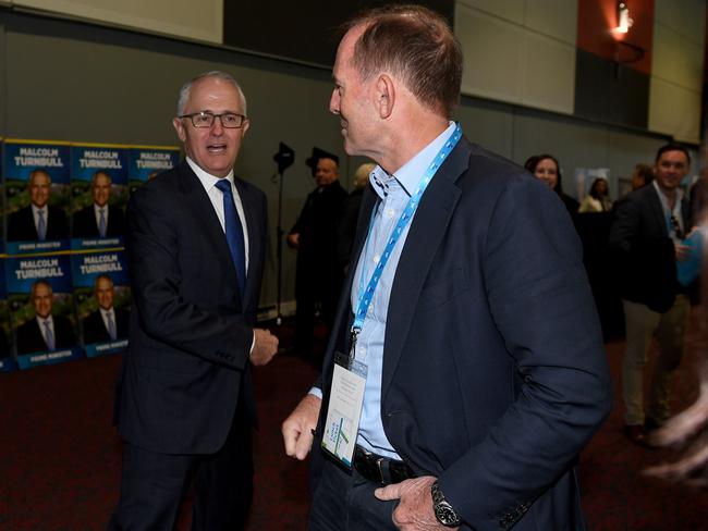 Prime Minister Malcolm Turnbull and former prime minister Tony Abbott speak during the NSW Liberal Party Futures convention, at Rosehill Racecourse, in Sydney this morning. Picture: AAP