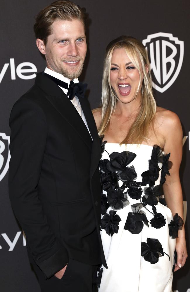 Laugh it off! Karl Cook, left, and Kaley Cuoco. Picture: AP 