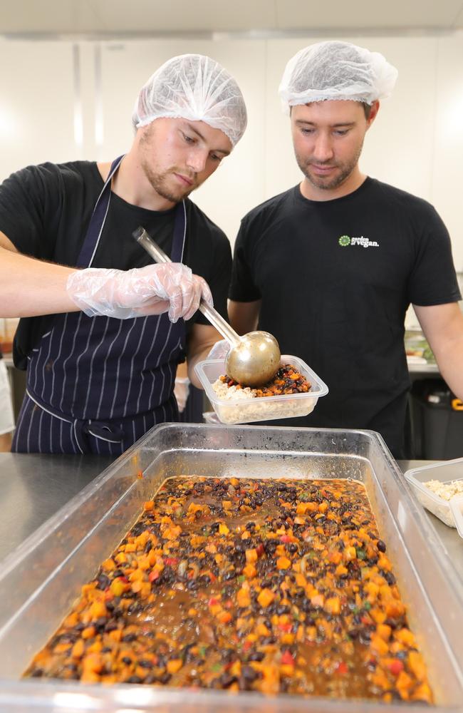 Druen Dorn and Gareth Sharples getting busy at Garden of Vegan at West Burleigh. Picture: Glenn Hampson