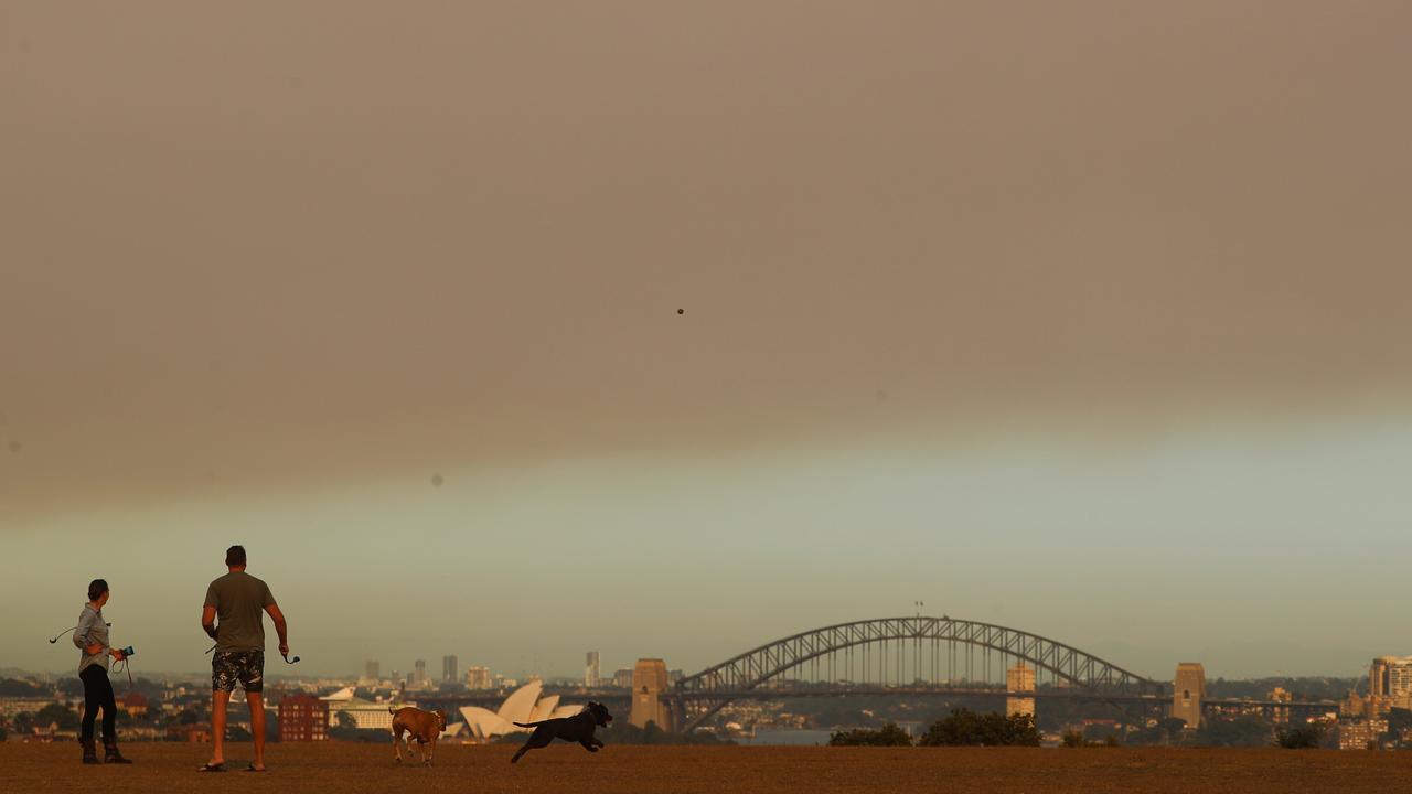 Thick bushfire smoke hangs high over Sydney. Picture: John Grainger