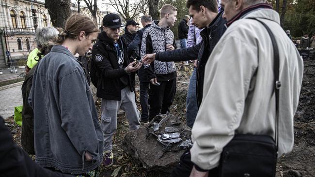 KYIV, UKRAINE - OCTOBER 10: Citizens inspect the rocket fragments left over from the Russia's missile attack, at Taras Shevchenko Park on Monday, October 10, 2022 in Kyiv, Ukraine. (Photo by Metin Aktas/Anadolu Agency via Getty Images)