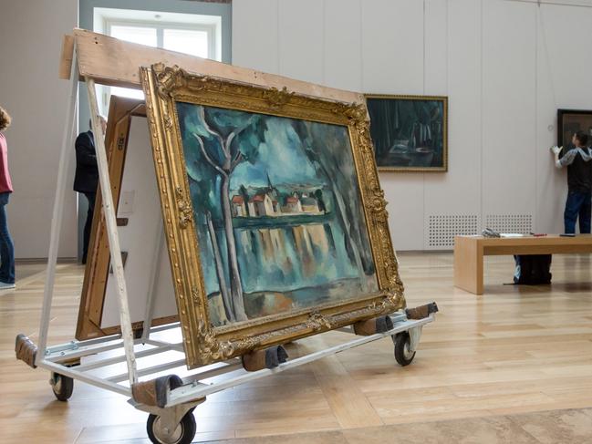 At The State Hermitage Museum in St Petersburg, Russia, pictures are removed from the walls to be sent to Sydney. Picture: The State Hermitage Museum, 2018/Svetlana Ragina