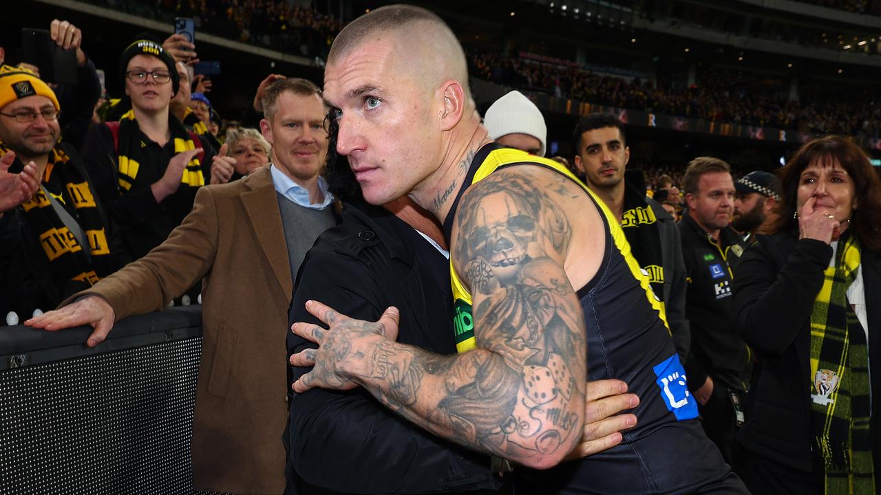 MELBOURNE, AUSTRALIA - JUNE 15: Dustin Martin of the Tigers embraces his agent Ralph Carr following his 300th match the round 14 AFL match between Richmond Tigers and Hawthorn Hawks at Melbourne Cricket Ground on June 15, 2024 in Melbourne, Australia. (Photo by Graham Denholm/Getty Images)