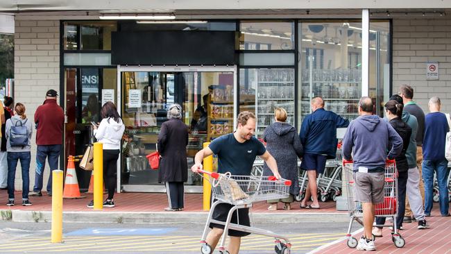 Shoppers lining up at Kurralta Park Coles earlier this month. Picture: AAP Image/ Russell Millard,