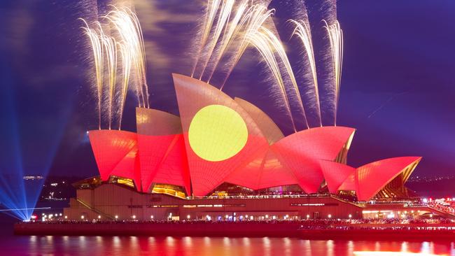 The colours of the Aboriginal flag are projected onto the Sydney Opera House on January 26, 2023. Picture: AFP