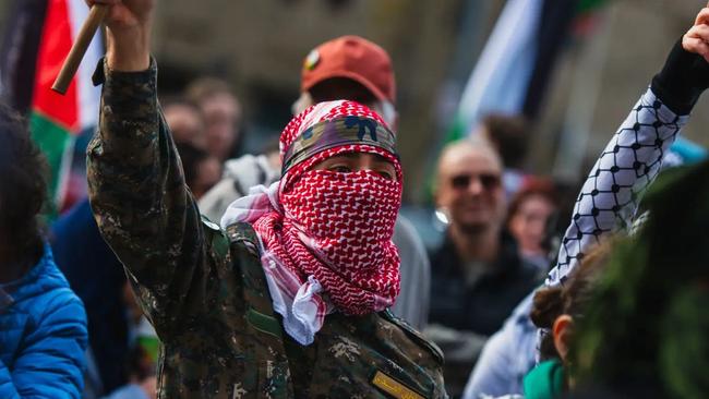 Man wears military uniform with a Jordanian Keffiyeh during the 41st pro-Palestinian protest in Melbourne.