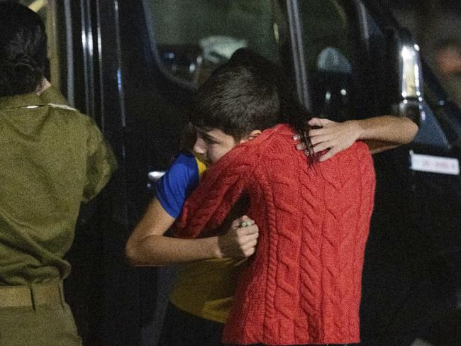 Former French-Israeli hostage, 12-year-old Eitan Yahalomi, reunited with his mother following his release by Hamas. Picture: IDF/AFP