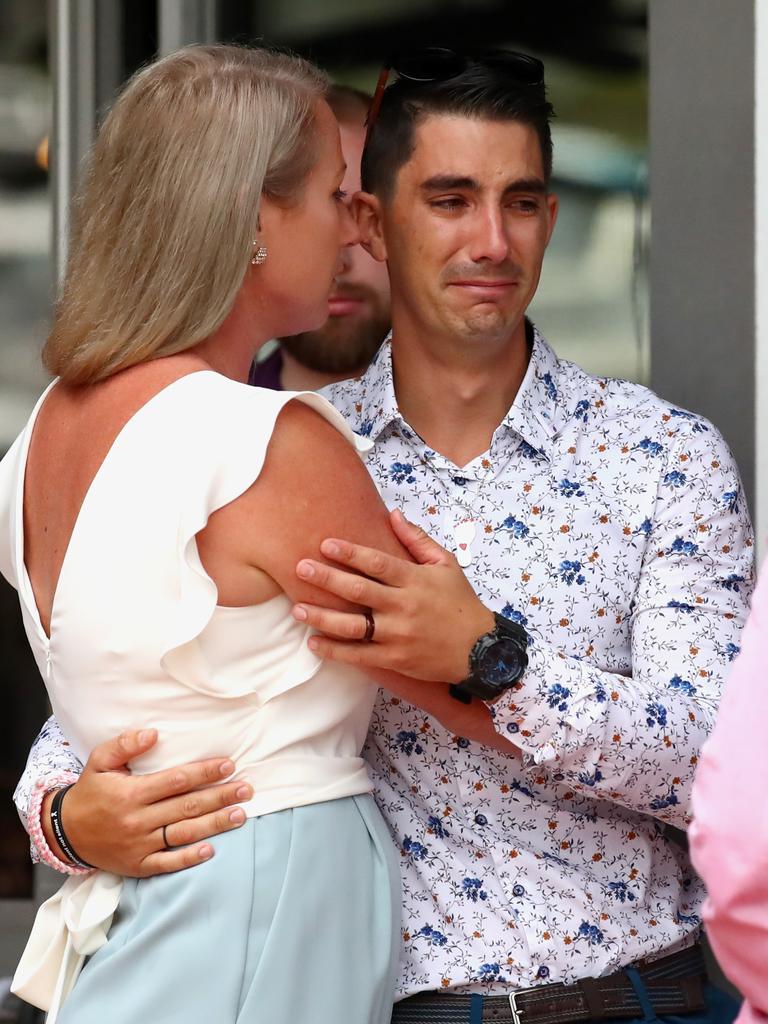 Nathaniel Clarke, brother of Hannah Clarke, is comforted by wife Stacey. Picture: Jono Searle/AAP