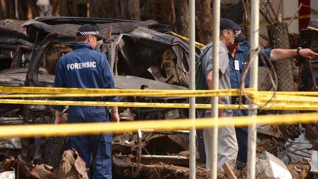 Australian Federal Police forensic experts join their Indonesian counterparts in sifting through the rubble of the October 12, 2002, bomb blast scene in Kuta. Picture: AAP