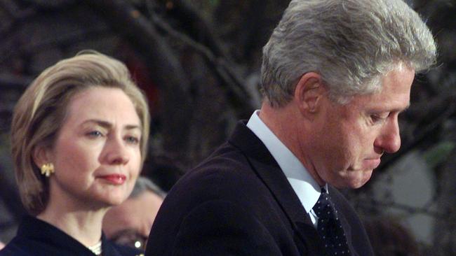 Hillary Rodham Clinton watches on as then-president Bill Clinton thanks those Democratic members of the House of Representatives who voted against impeachment in this December 19, 1998 photo. Picture: AP