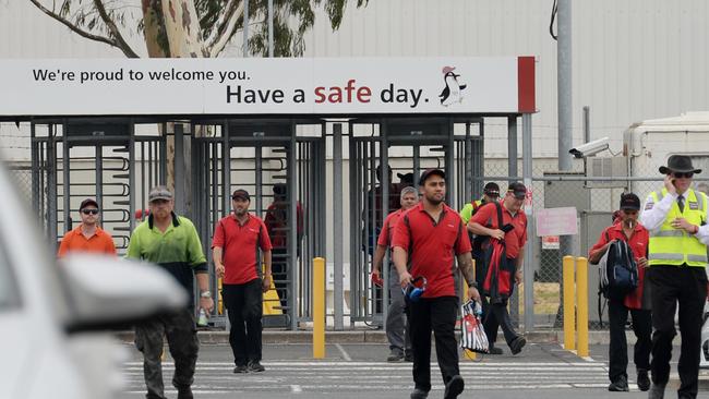 Bad news ... Toyota Altona workers leave the factory after hearing of the closure in 2017.