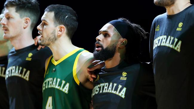 Patty Mills sings the national anthem with Boomers teammates ahead of Australia’s friendly match against Canada last month. Picture: Getty Images