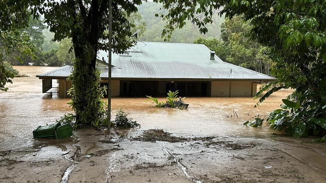 A nurse's house is submerged by floodwaters in Wujal Wujal during the record flood.