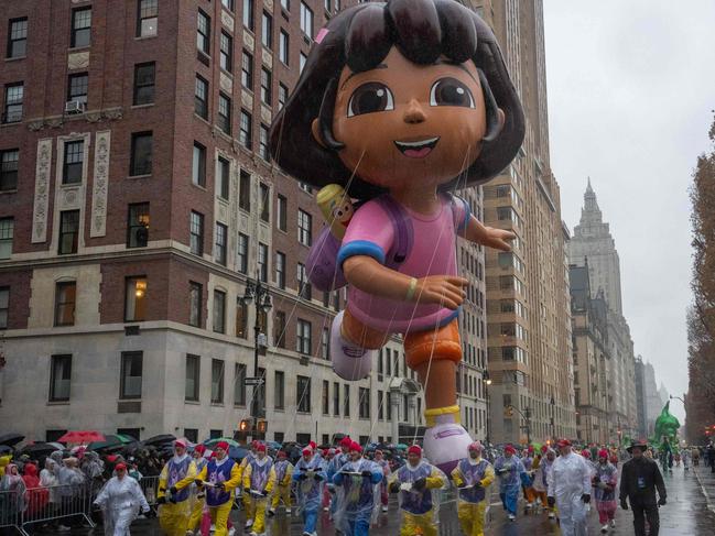 Dora the Explorer balloon floats down the street during the annual Macy's Thanksgiving Day Parade in New York City. Picture: AFP