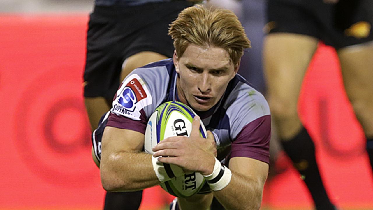 Tate McDermott of Reds flies to score a try during a match against the Jaguares. Picture: Daniel Jayo/Getty Images