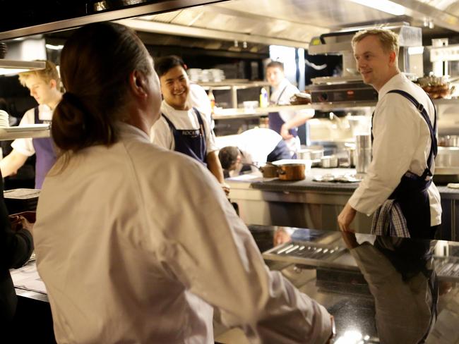 Neil Perry talking to Rockpool Head Chef Phil Wood at the Rockpool restaurant.