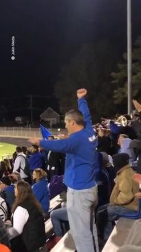 Dad does cheerleader dance with daughter