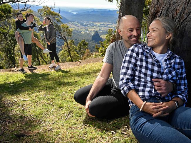 24/06/2022 : Kate Lawrance and partner Justin Johnson with their son Eden Johnson 17 and daughters Kirra  15 and Emily Johnson 13 (in shorts) ,  visiting the site of the burnt down Binna Burra Lodge, at Binna Burra in the mountains behind the Gold Coast. There is to be a new replacement lodge development after the original building destroyed in 2019 bushfires . Lyndon Mechielsen/The Australian